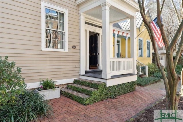 entrance to property with a porch