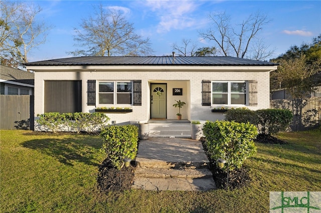 ranch-style home with a front lawn