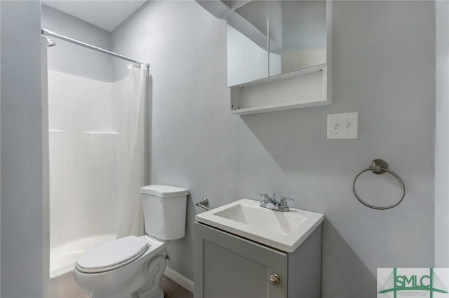 full bathroom with vanity, toilet, and a stall shower