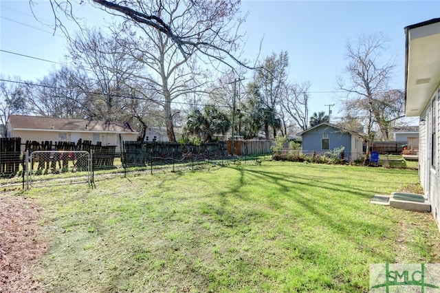 view of yard with a fenced backyard