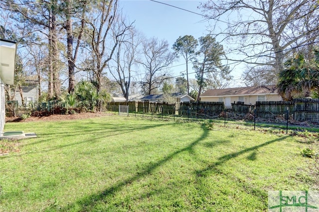 view of yard featuring a fenced backyard