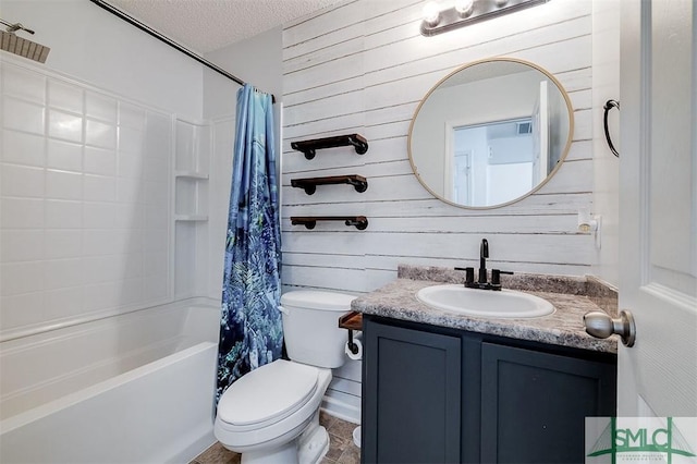 bathroom with vanity, wooden walls, a textured ceiling, toilet, and shower / bathtub combination with curtain