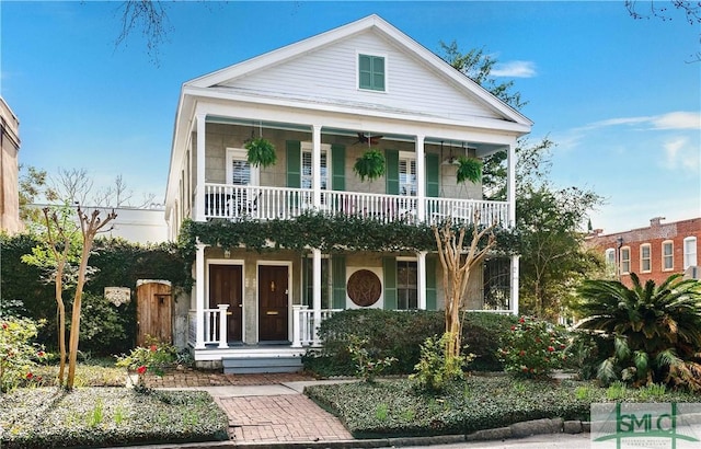 view of front of property with a porch and a balcony