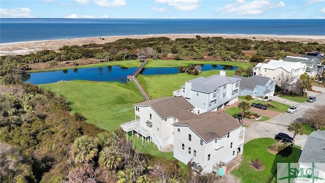 birds eye view of property with a water view and a residential view