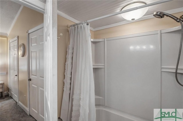 bathroom featuring ornamental molding and shower / bath combo