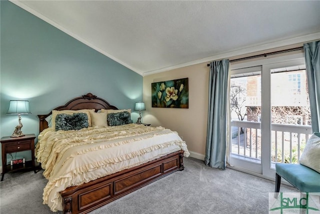 bedroom featuring ornamental molding, carpet, multiple windows, and vaulted ceiling