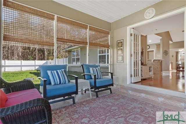 interior space with fence and outdoor lounge area