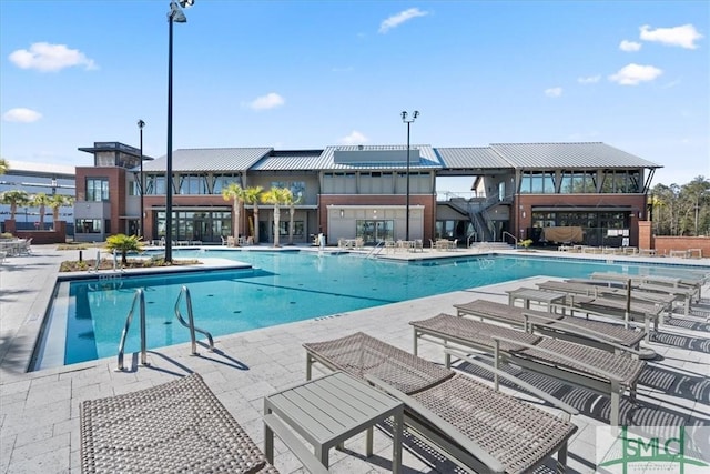 230 Blackjack Oak Dr W, Richmond Hill, GA 31324 - community pool featuring a patio area