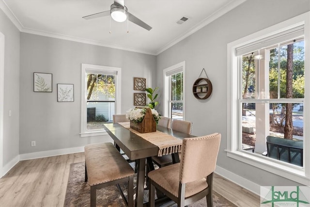 230 Blackjack Oak Dr W, Richmond Hill, GA 31324 - dining room with healthy amount of natural light, light wood-type flooring, ornamental molding, and a ceiling fan