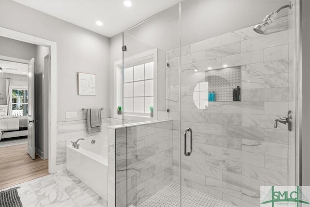 230 Blackjack Oak Dr W, Richmond Hill, GA 31324 - full bathroom featuring ensuite bath, a bath, marble finish flooring, a stall shower, and recessed lighting