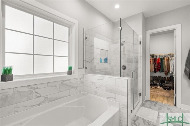 230 Blackjack Oak Dr W, Richmond Hill, GA 31324 - bathroom with a garden tub, marble look tiles, a stall shower, a walk in closet, and recessed lighting