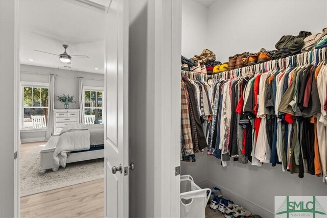 230 Blackjack Oak Dr W, Richmond Hill, GA 31324 - spacious closet with ceiling fan and wood finished floors