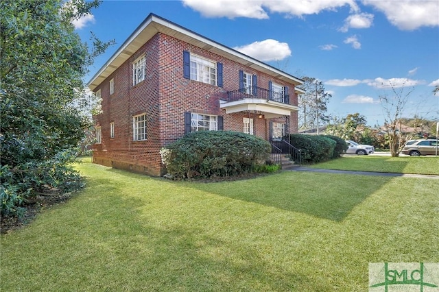 view of side of home featuring crawl space, a balcony, and brick siding