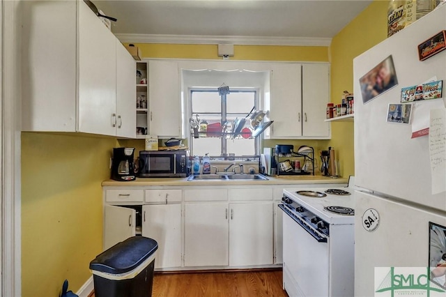 kitchen with light countertops, white appliances, open shelves, and white cabinets