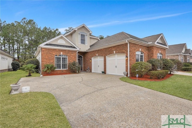 traditional home with brick siding, a shingled roof, a front yard, a garage, and driveway