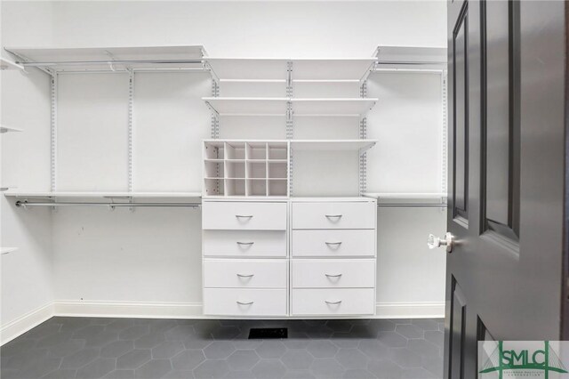 106 Commodore Dr, Savannah, GA 31410 - spacious closet featuring dark tile patterned flooring