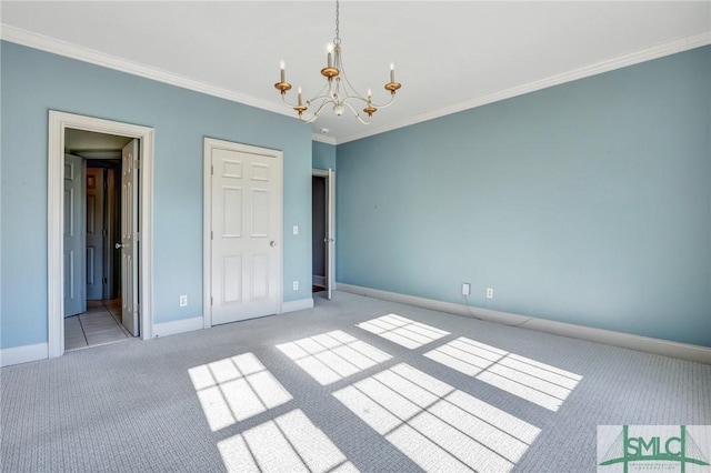 106 Commodore Dr, Savannah, GA 31410 - unfurnished bedroom featuring crown molding, baseboards, carpet floors, and a chandelier