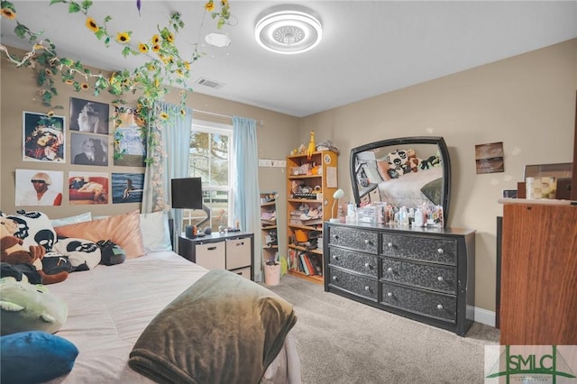 bedroom featuring carpet, visible vents, and baseboards