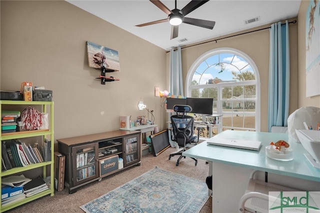 office area with light carpet, ceiling fan, and visible vents