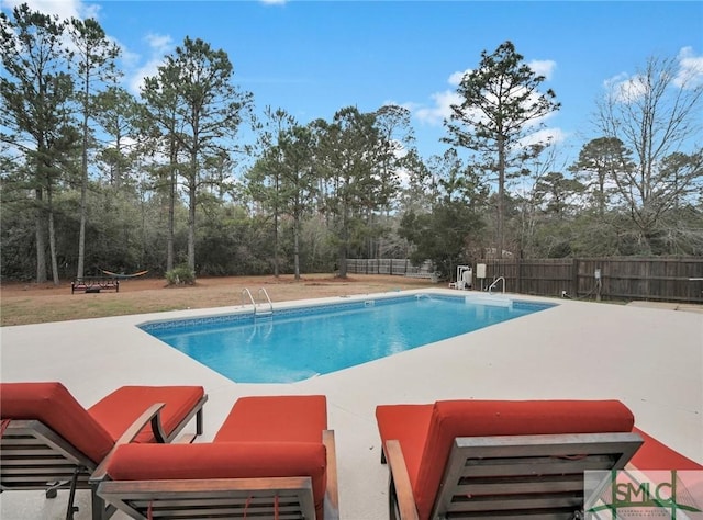 view of pool featuring a patio area, fence, and a fenced in pool