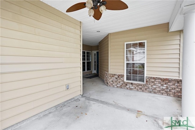 view of patio featuring ceiling fan