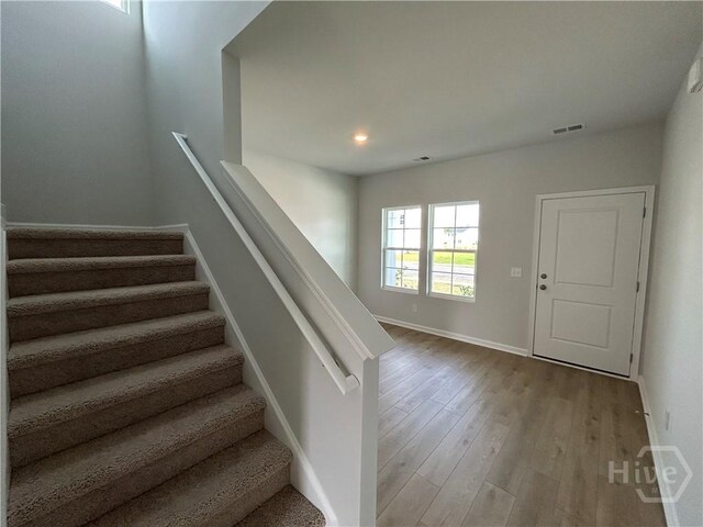 108 Stillhouse Dr, Springfield, GA 31329 - stairs with wood finished floors and recessed lighting