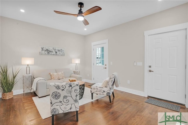 living room with ceiling fan, baseboards, wood finished floors, and recessed lighting