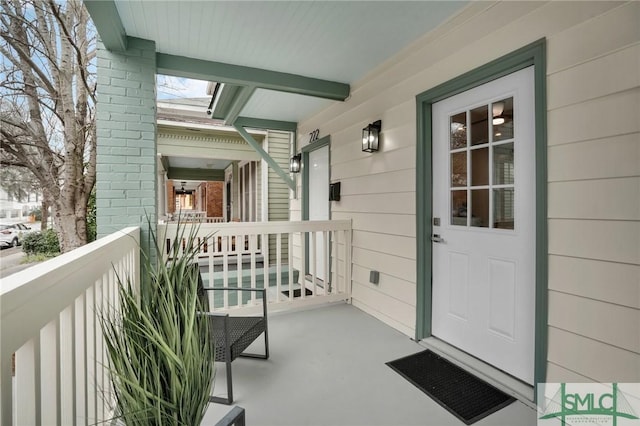 property entrance with covered porch