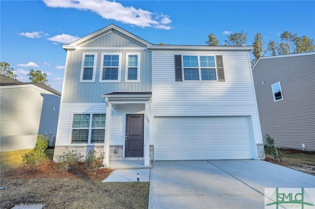 traditional home with driveway, stone siding, a garage, and board and batten siding