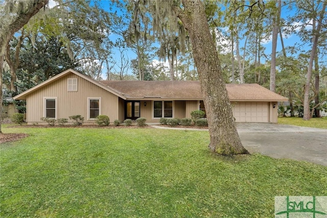 ranch-style house with driveway, an attached garage, and a front lawn