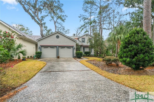 view of front of home featuring a garage and driveway