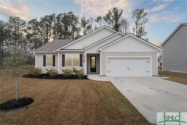 ranch-style house featuring driveway, a lawn, and an attached garage