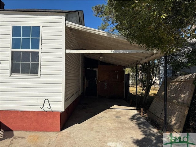 view of car parking with a carport and driveway