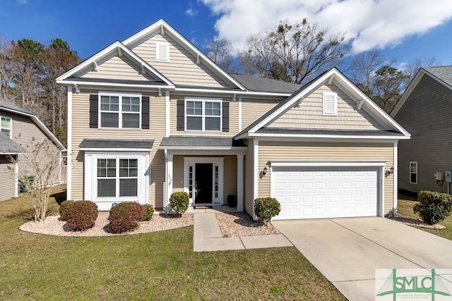 traditional-style house featuring a front lawn, driveway, and an attached garage