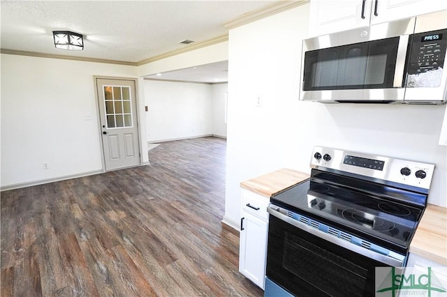 kitchen featuring dark wood finished floors, ornamental molding, stainless steel appliances, white cabinetry, and wooden counters