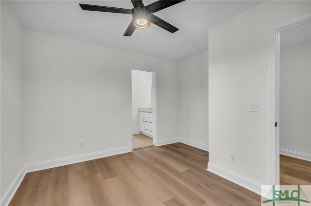 unfurnished bedroom featuring light wood finished floors, baseboards, and a ceiling fan