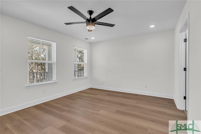 spare room with ceiling fan, baseboards, wood finished floors, and recessed lighting