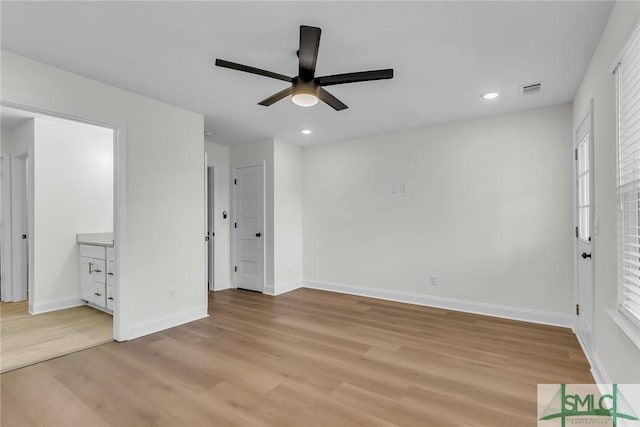 unfurnished bedroom featuring light wood-style floors, recessed lighting, visible vents, and baseboards