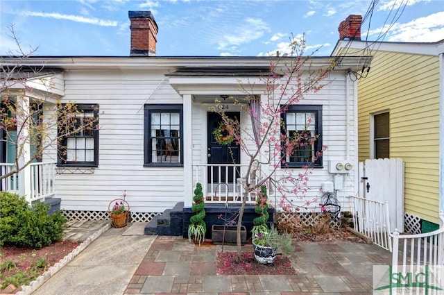 exterior space featuring a patio and a chimney