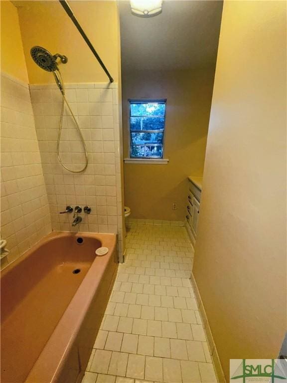 bathroom with toilet, shower / tub combination, baseboards, and tile patterned floors