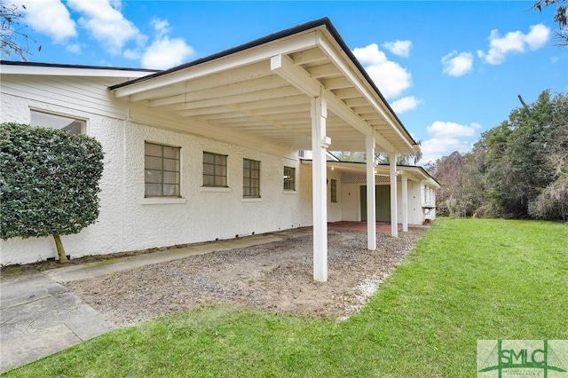 exterior space with an attached carport