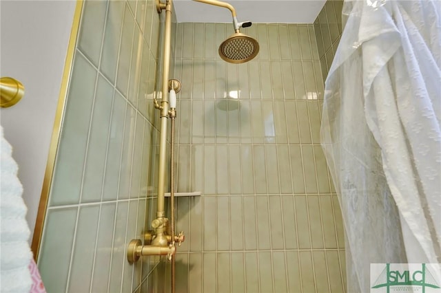 full bath with a tile shower