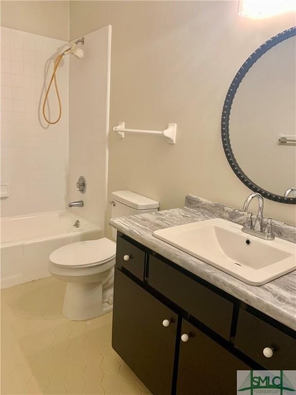 bathroom featuring toilet, bathtub / shower combination, and vanity