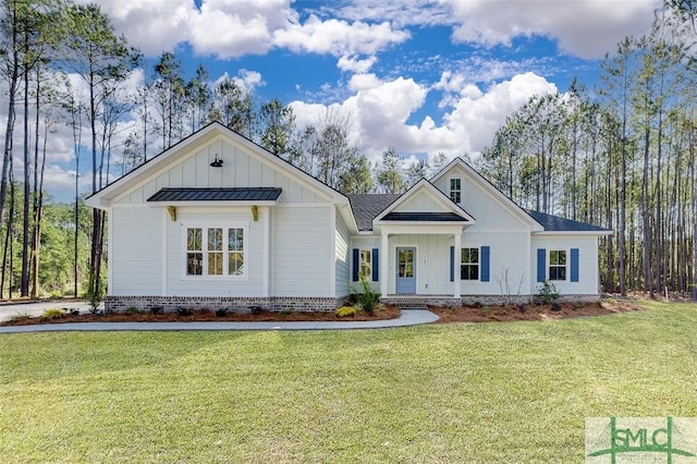 modern inspired farmhouse with roof with shingles, board and batten siding, and a front yard