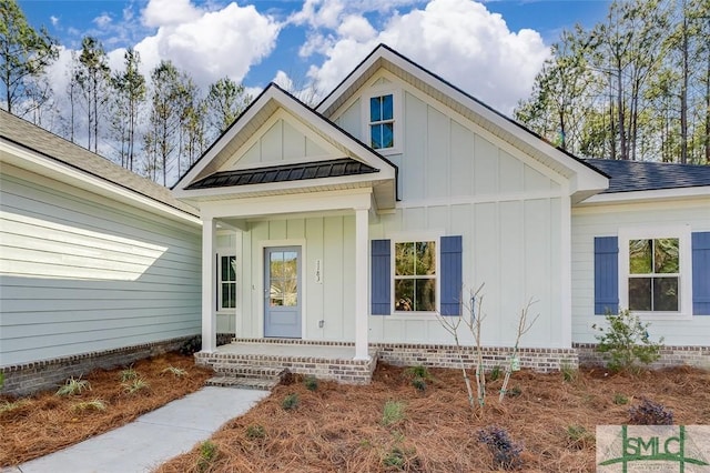 view of front of home featuring board and batten siding, crawl space, and roof with shingles