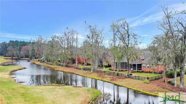 property view of water featuring fence