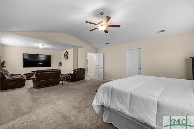 bedroom with carpet floors, visible vents, vaulted ceiling, and a ceiling fan