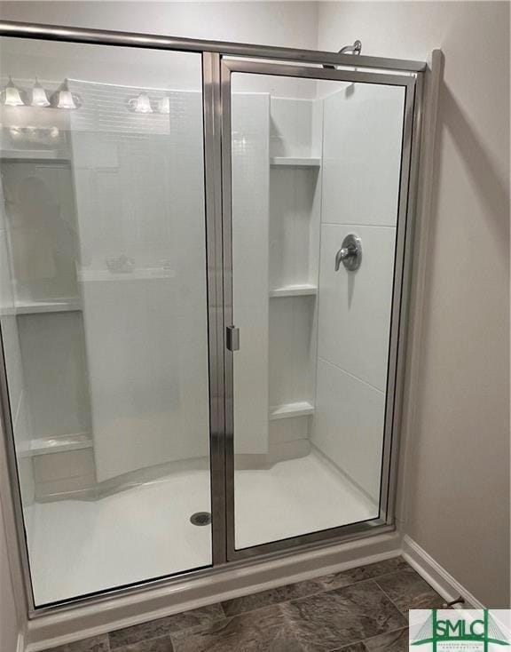 full bathroom featuring a stall shower