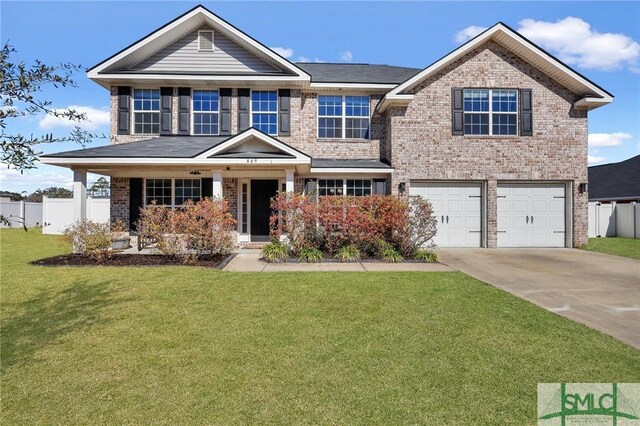 469 Nashview Trl, Allenhurst, GA 31301 - view of front of house with driveway, brick siding, and a front yard