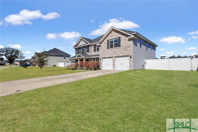 469 Nashview Trl, Allenhurst, GA 31301 - traditional-style house featuring a garage, concrete driveway, fence, a front yard, and brick siding